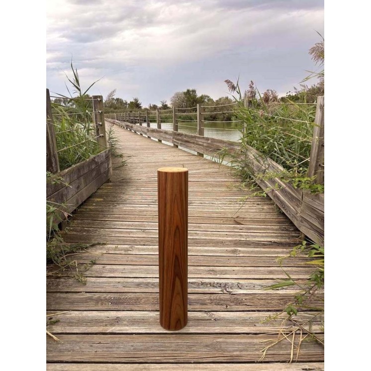 15-minute Rain Pillar with rosewood finish shown in an outdoor setting on a wooden walkway