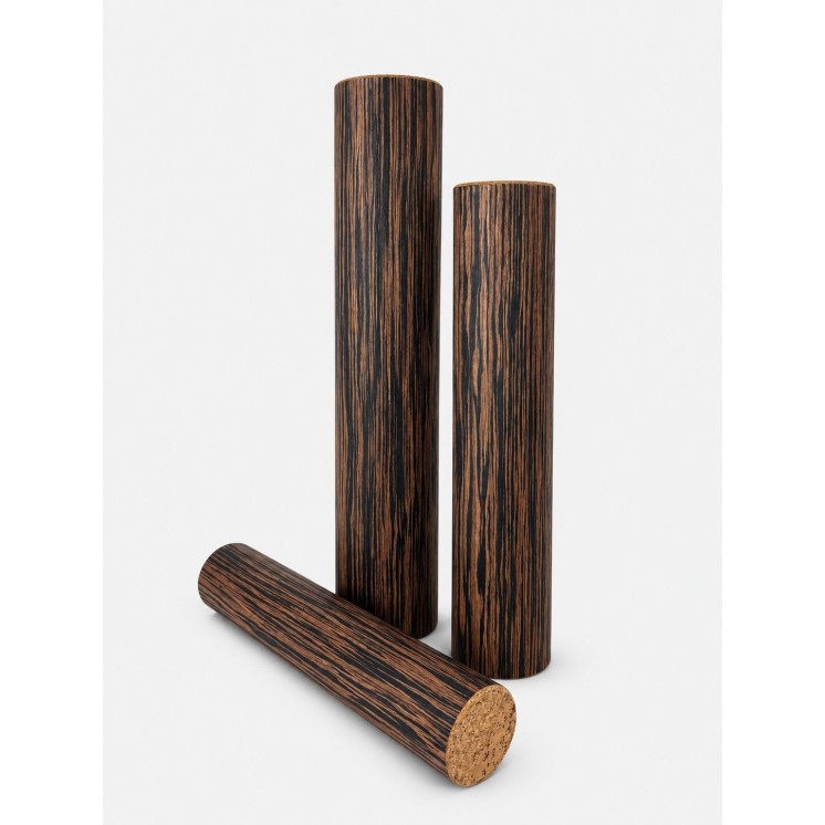 8-minute Rain Pillar with ebony finish in an outdoor setting on a wooden walkway