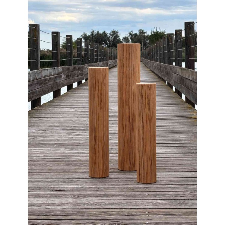 8-minute Rain Pillar with zebrano finish in an outdoor setting on a wooden walkway