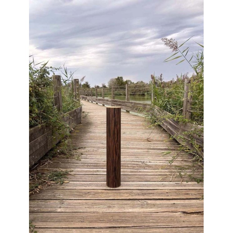 15-minute Rain Pillar with ebony finish shown in an outdoor setting on a wooden walkway